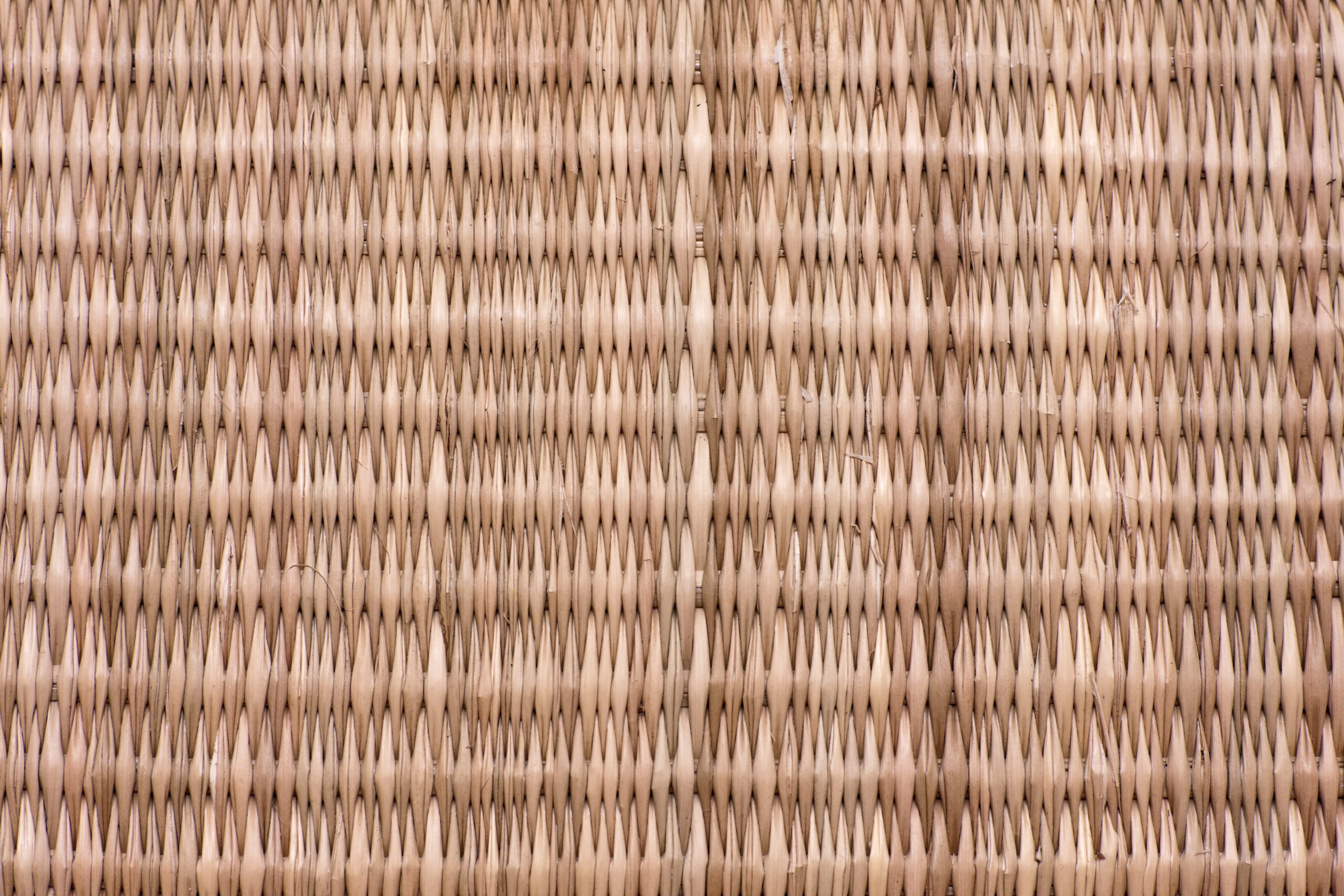 Close-up image of woven straw basket.