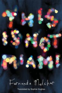 Cover of This is Not Miami: The title is spelled out in colorful lights, appearing soft and out-of-focus against a navy-blue background. Below, the author's name is penned in narrow, wobbly script.