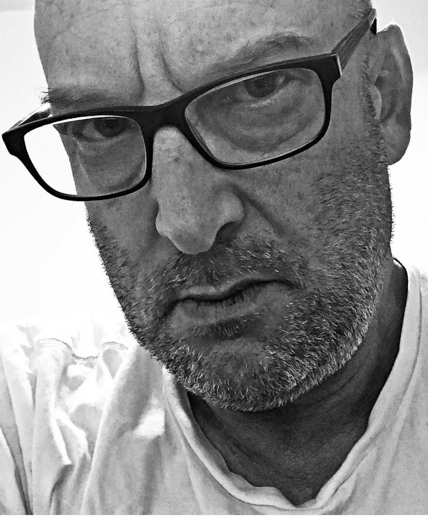 Richard Siken headshot white man black glasses white shirt
